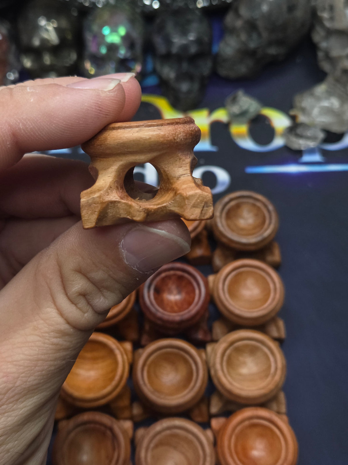 Small carved wood sphere holder