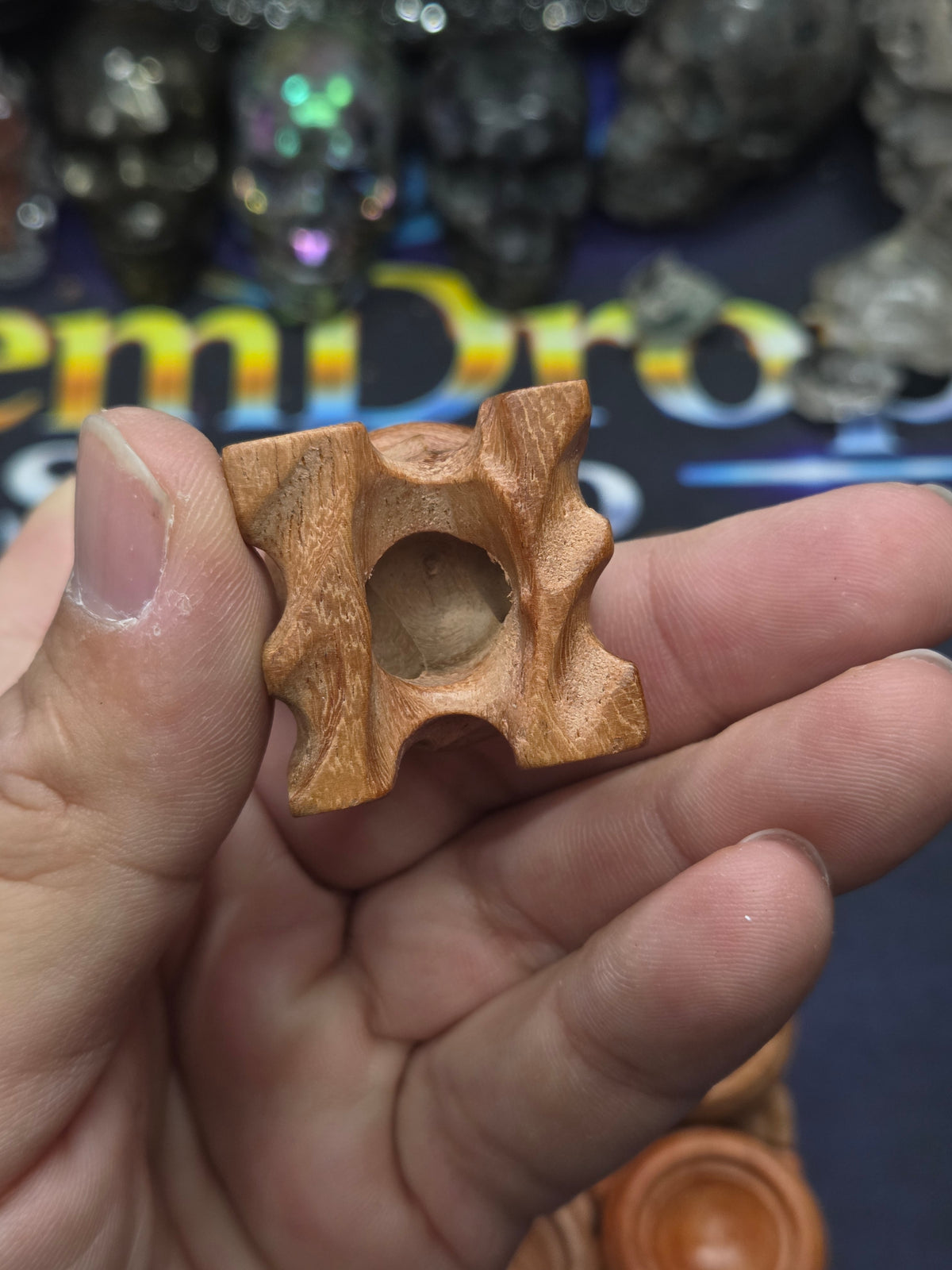 Small carved wood sphere holder